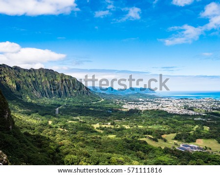 panoramic view of the winward side of Oahu from the Pali lookout in nuuanu (Nu'uanu) Hawaii. Nuuanu pali lookout is a viewing stand in the northeastern part of Oahu, Hawaii, USA Royalty-Free Stock Photo #571111816