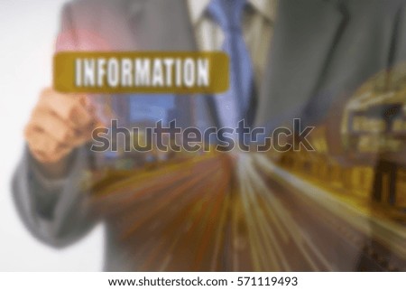 Business futuristic touchscreen with business conceptual text and light trail. Blurred background and lens flare added. Blurred image