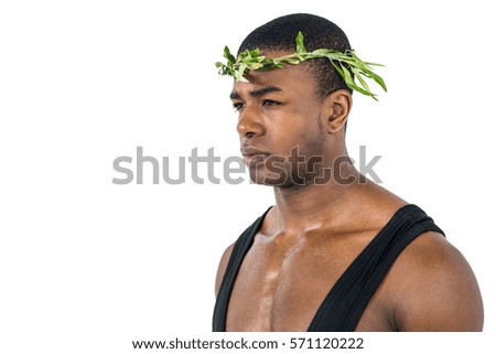 Athlete wearing a laurel wreath and standing on white background