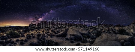 View of the Milky Way Galaxy at the Joshua Tree National Park.  The image is an hdr of astro photography photographed at night.  It depicts science and the divine heaven. Royalty-Free Stock Photo #571149160