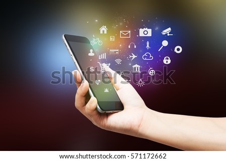 Mobile Application concept.hand holding smart phone Royalty-Free Stock Photo #571172662
