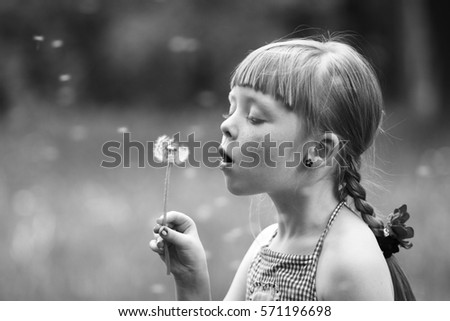 a small child, with wondering eyes Royalty-Free Stock Photo #571196698
