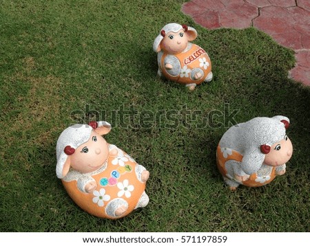 Cute cartoon sheep in garden