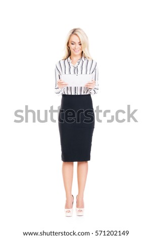 Young, confident, successful and beautiful business woman with the tablet computer isolated on white. Occupation, career, job concept.