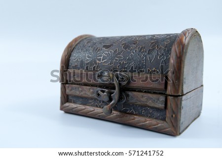 Ancient dark brown wooden treasure chest in isolated background