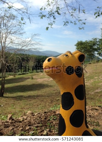 giraffe doll in the garden