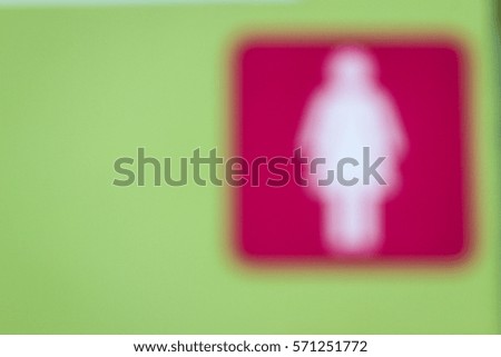blurred woman toilet sign