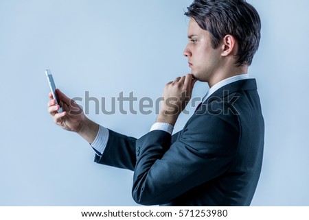 young businessman looking a smart phone