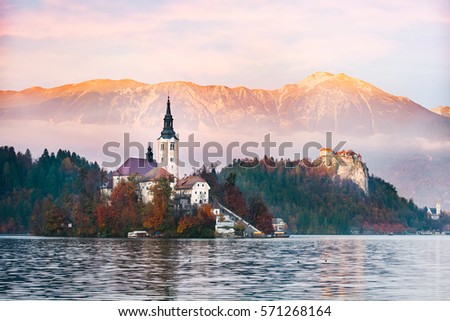 Amazing view of Julian Alps and lake Bled with St. Marys Church of the Assumption on the small island; Bled, Slovenia, Europe.