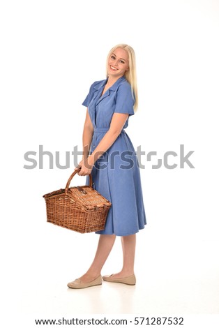 full length portrait of a blonde haired woman wearing a simple blue dress.
standing pose  isolated on white background.
