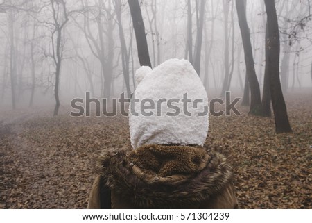 Girl in a foggy forest