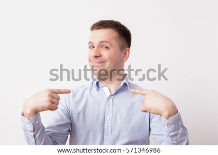 Self-satisfied and proud young man haughtily looks forward Royalty-Free Stock Photo #571346986