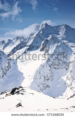 Scenic winter mountain landscape Snowy peaks against the blue sky