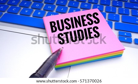 Colourful sticky note with text on keyboard with selective focus. Business concept