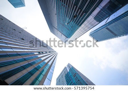 Looking up at business buildings