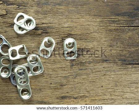 Ring pull aluminium on wood background