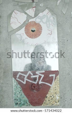 Abstract picture of reflection of a person on a shattered mirror concept of magic, witchcraft, dream or nightmare with copy space for runaround or wraparound text 