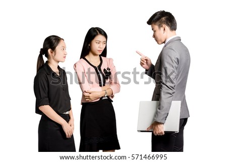 Portrait of three coworkers arguing at work. Young furious man yelling at annoyed stressed woman with pointed finger. Negative human emotions. Isolated on white background with copy space