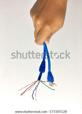Hand holding Cat6 networking cable.Isolated on white background. For concept industry,business,education and related.