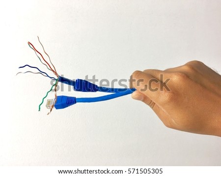 Hand holding Cat6 networking cable.Isolated on white background. For concept industry,business,education and related.