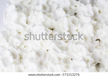 Whipped cream milk cream texture. Whipping cream as background. Whips cream from spray for cooking eating.