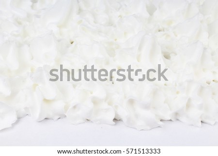 Whipped cream milk cream texture. Whipping cream as background. Whips cream from spray for cooking eating.