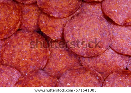 Texture with cut salami design. Sliced salami sausage pattern. Snags red meat pattern texture background. 