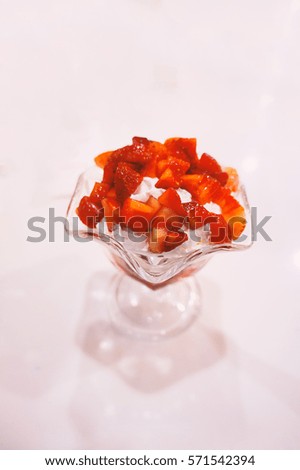 Strawberry ice cream sundae isolated on white background with copy space. Add classic chrome film simulation. For food.