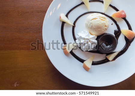 hot chocolate lava cake with vanilla ice cream ball, apple and whipped cream