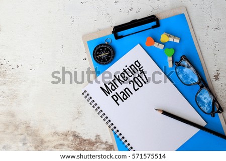 Marketing Plan 2017 - Business concept top view notebook