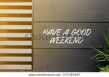 HAVE A GOOD WEEKEND - business concept words on the wall Royalty-Free Stock Photo #571585897