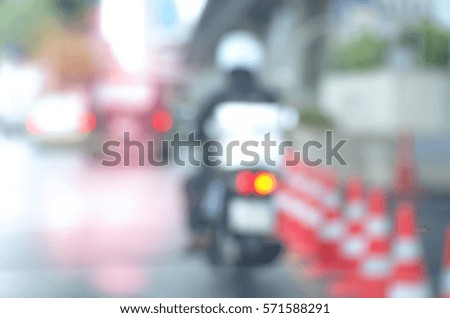 Blurred abstract background and can be illustration to article of Delivery man riding motorcycle