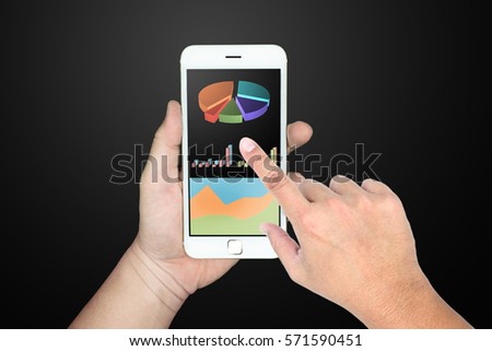 Hand holding mobile phone with stock analyzing graph