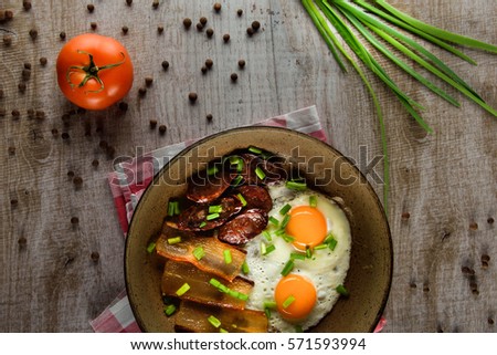 Ukrainian light breakfast. Breakfast in the pan on a wooden background