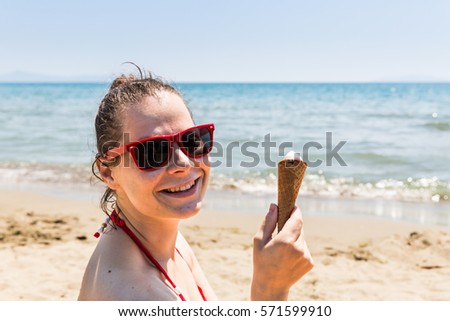 View of a girl at the beach of the Tyrrhenian sea in the Italian region Tuscany