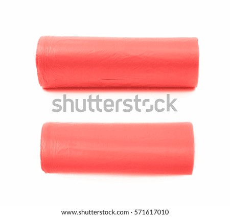 Red plastic polyethylene trash bag roll isolated over the white background, set of two different foreshortenings