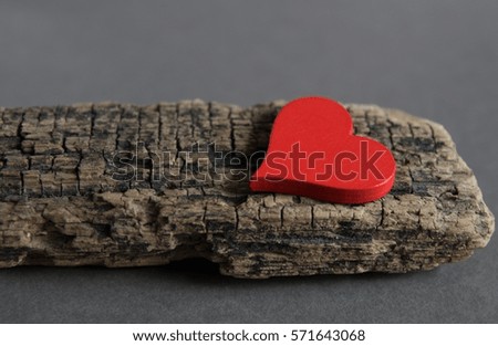 Valentines day. Red hearts on gray background. Wood