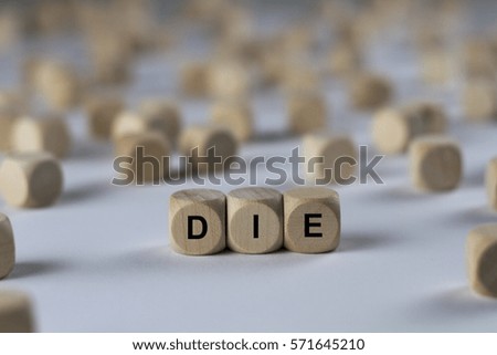 die - cube with letters, sign with wooden cubes