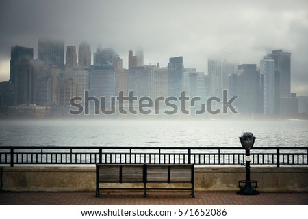 New York City downtown business district in a foggy day viewed from park