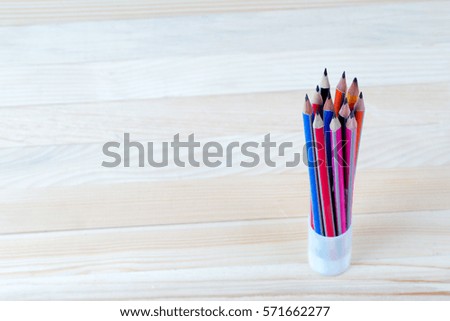 Pencils on a wooden table. Back to school. Copy space.