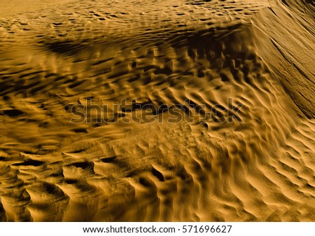 Golden sands of the desert. African untouched wild nature. Barchans and Sand Dunes. High resolution. Background and texture
