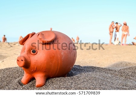 Photo Picture of a Piggy Bank on the Sand Beach