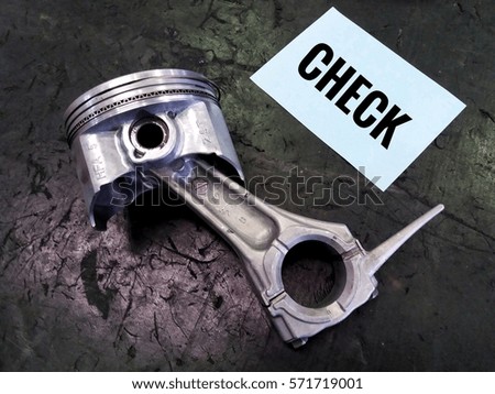 conceptual images of piston assembly and word - Check with black board/selective focus/low light/bright/vintage