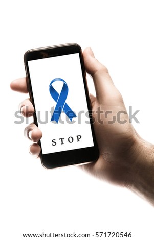 Hand holding smartphone, blank screen with blue ribbon isolated on white background. World Cancer Day graphic. Prostate, colon, esophageal cancer, stomach cancer concept