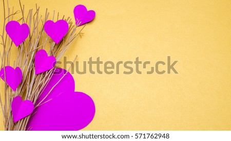 heart paper and branch on yellow background