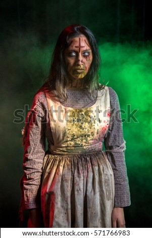 Special effects makeup and theatrical lighting bring this possessed girl character to life