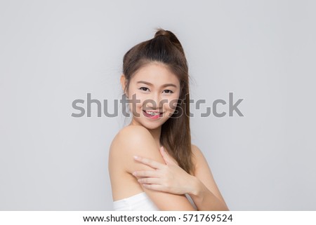 Beautiful Attractive Asian woman smile  and cross arm feeling so confident and happiness with Healthy skin,Isolated on white background,Beauty Concept