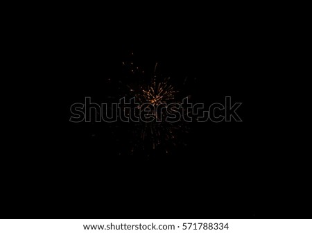 Fireworks display from homes in conjunction with chinese new year celebration / Fireworks background / Artistically defocused for abstract background purposes and colorized in orange and red color