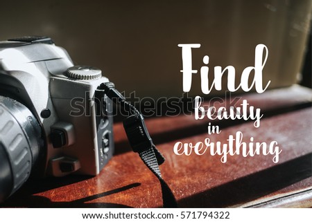 Isolated calligraphy on Camera film on brown wooden stairs. Quote about photo and photography. Find beauty in everything.