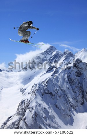 flying skier on mountains Royalty-Free Stock Photo #57180622